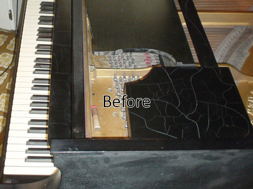 A before photo of a piano that has cracks in the finish.